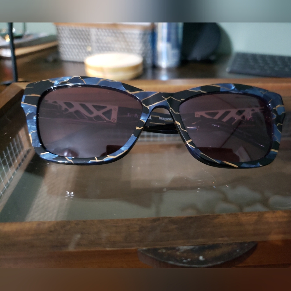 L.A.M.B glasses.